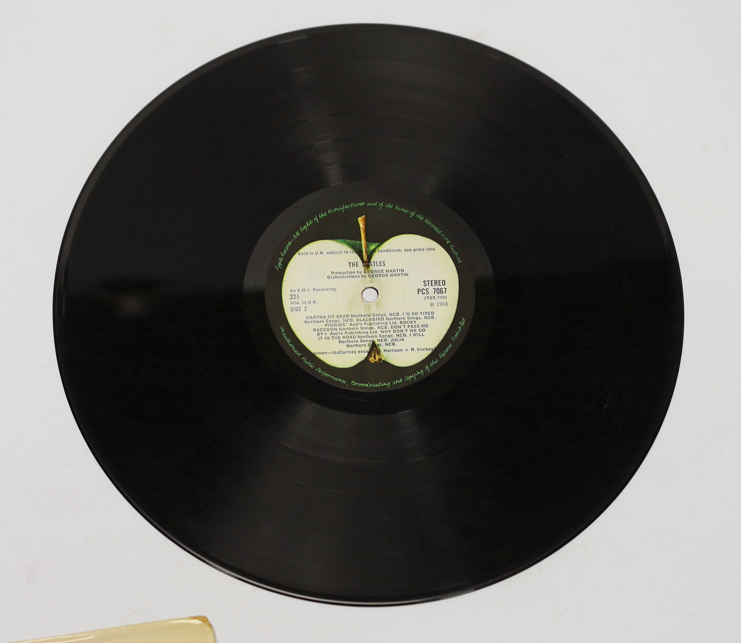 The Beatles; The White Album, top opening cover numbered 0557785, two LPs with set of four photographs and booklet, missing inner sleeves